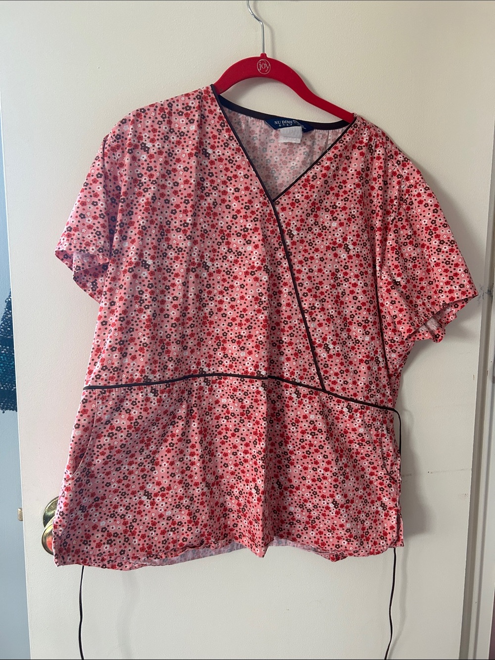 Pink Floral Wrap Tunic with Black Trim tag with size is worn but it fits like an